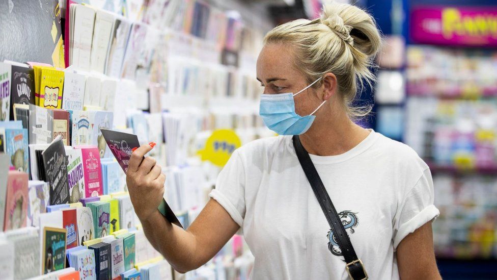Maria Murtagh shopping in the Card Factory in Belfast while wearing a face mask as face coverings are now compulsory for shoppers in Northern Ireland.