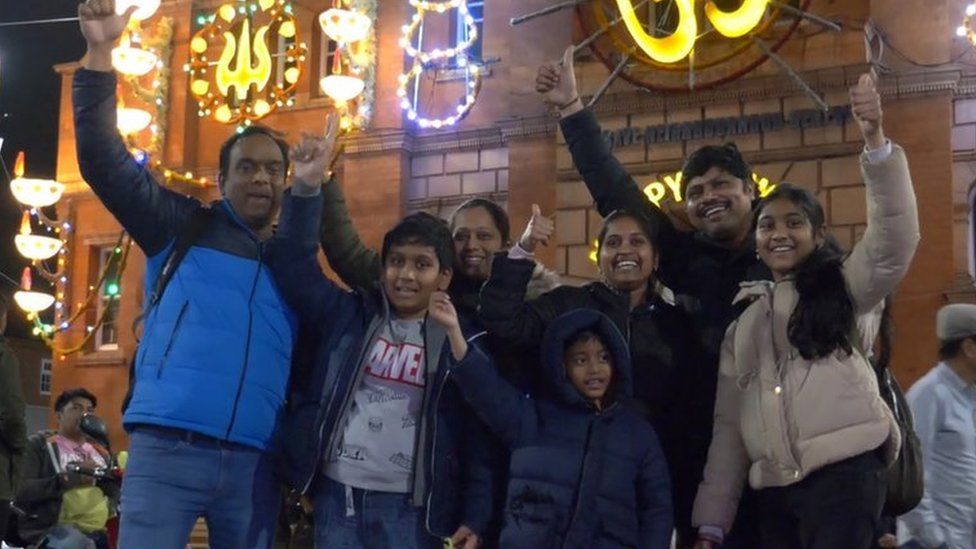 Family enjoy lights switch-on