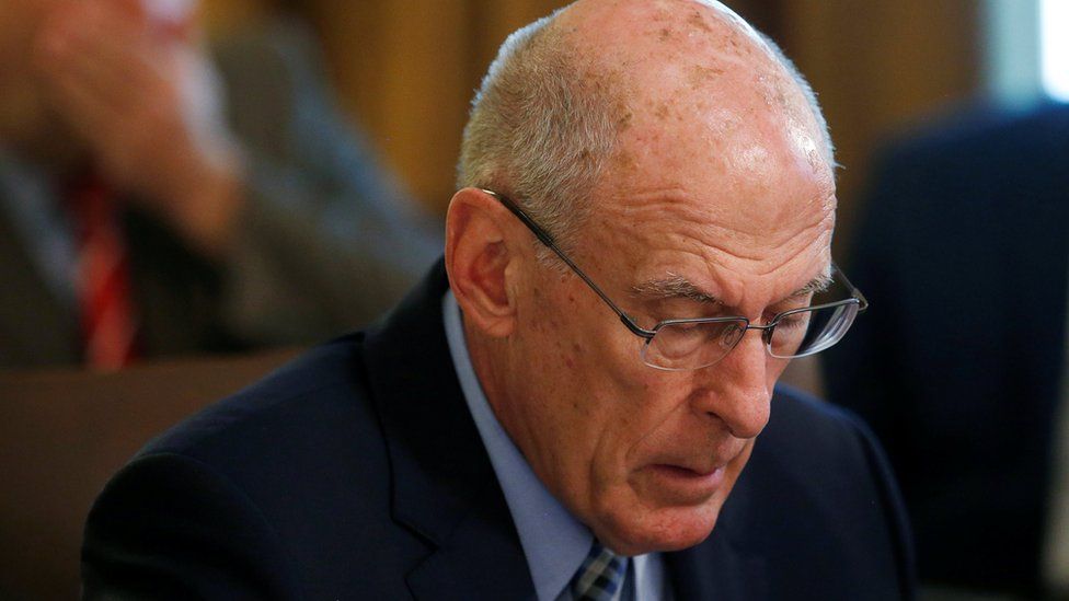 US Director of National Intelligence Dan Coats listens with his head down during a cabinet meeting at the White House in Washington