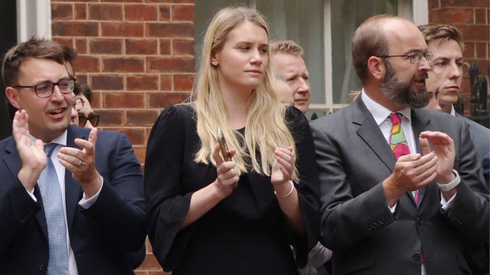 Charlotte Owen (centre) watches as Boris Johnson announces his resignation outside 10 Downing Street in July 2022