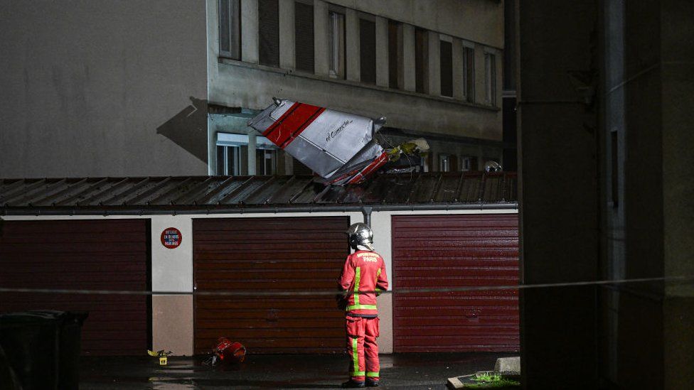 The tail of the aircraft detached from the rest of the cabin and landed on the roof of a garage