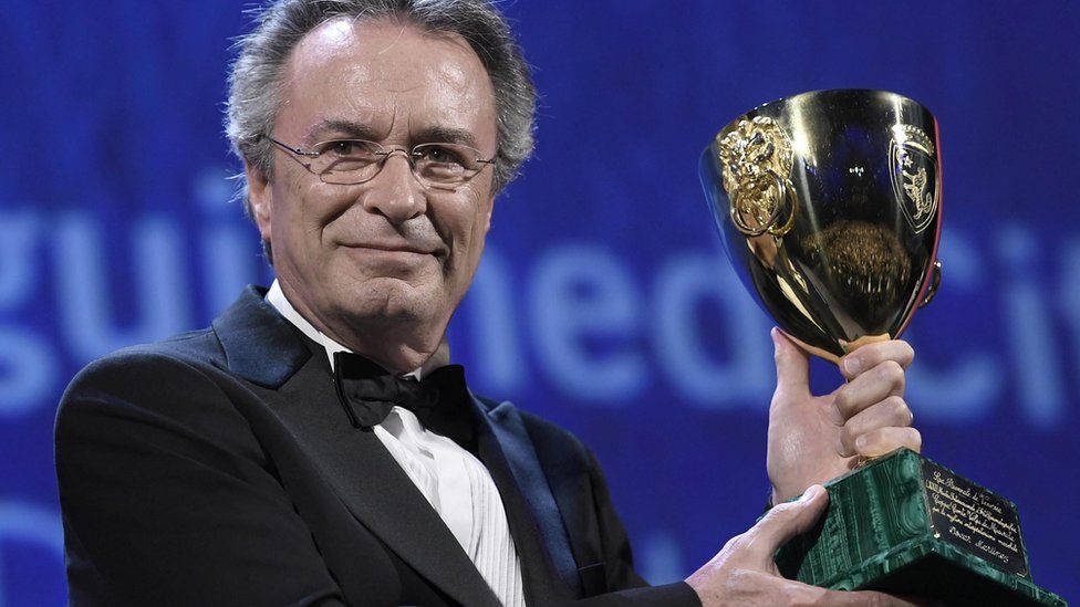 Argentine actor Oscar Martinez holds his Volpi Award (Coppa Volpi) for the best interpretation in the movie The Distinguished Citizen