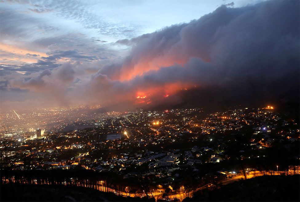 A fire is seen burning on Table Mountain overlooking Cape Town, South Africa