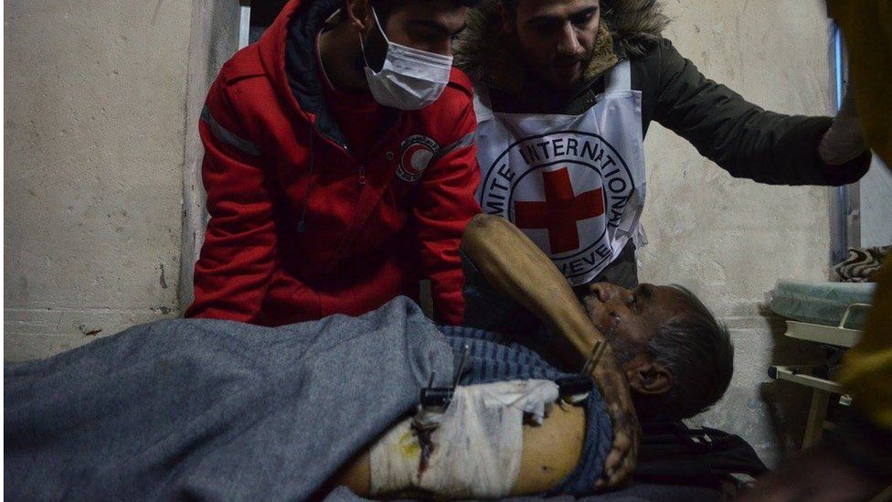 Man with clamp on arm being put in ambulance, eastern Aleppo, Wednesday 7 December 2016