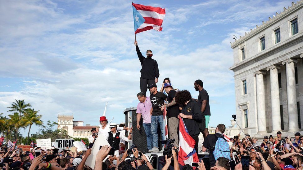 Protesters take part in a demonstration in San Juan