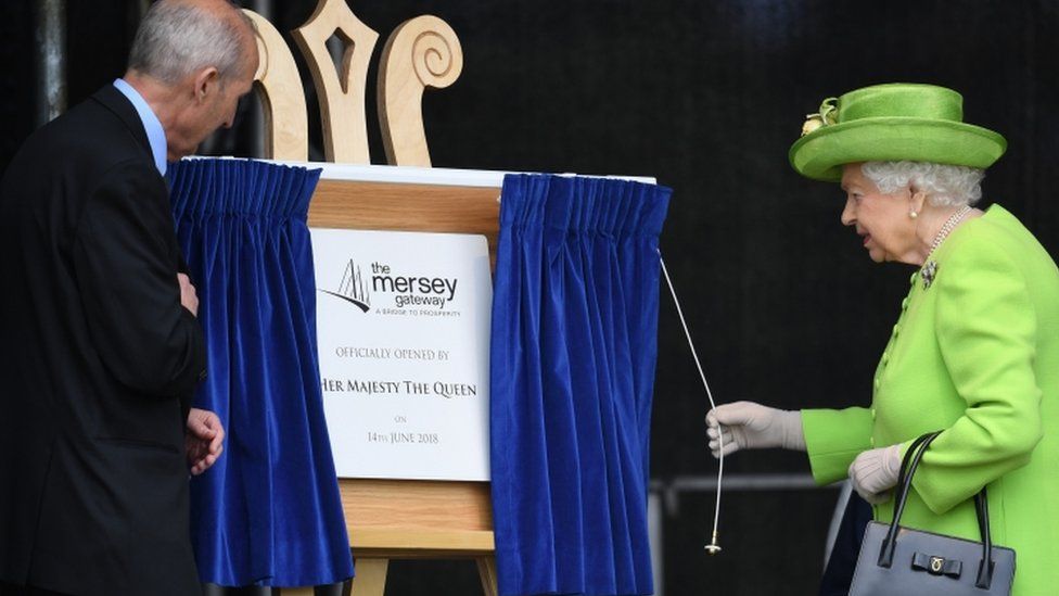 Queen Elizabeth II officially pulls the curtain to open the new Mersey Gateway Bridge