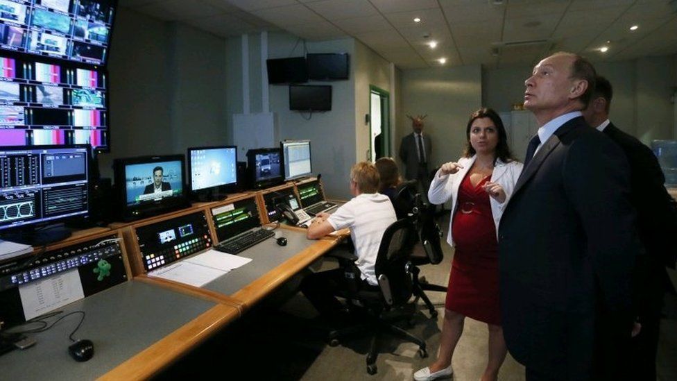 Russian President Vladimir Putin and Russia Today Editor-in-Chief Margarita Simonyan at the headquarters of the "Russia Today" television channel in Moscow, Russia in June 2013