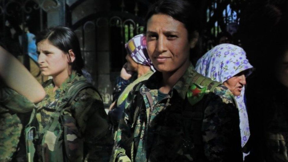 Kurdish female fighter Barin Kobani (right)