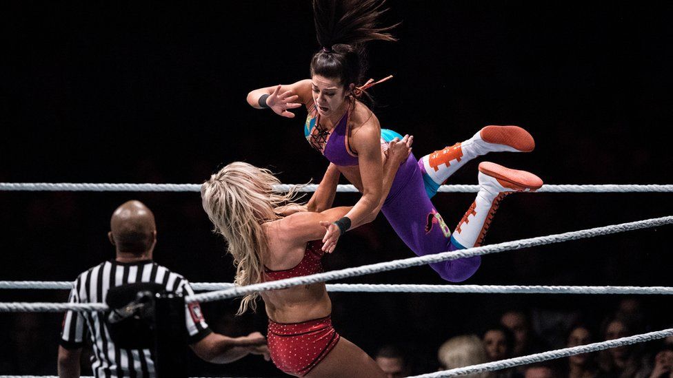 Charlotte Flair and Bayley fight during to the WWE Live Duesseldorf event