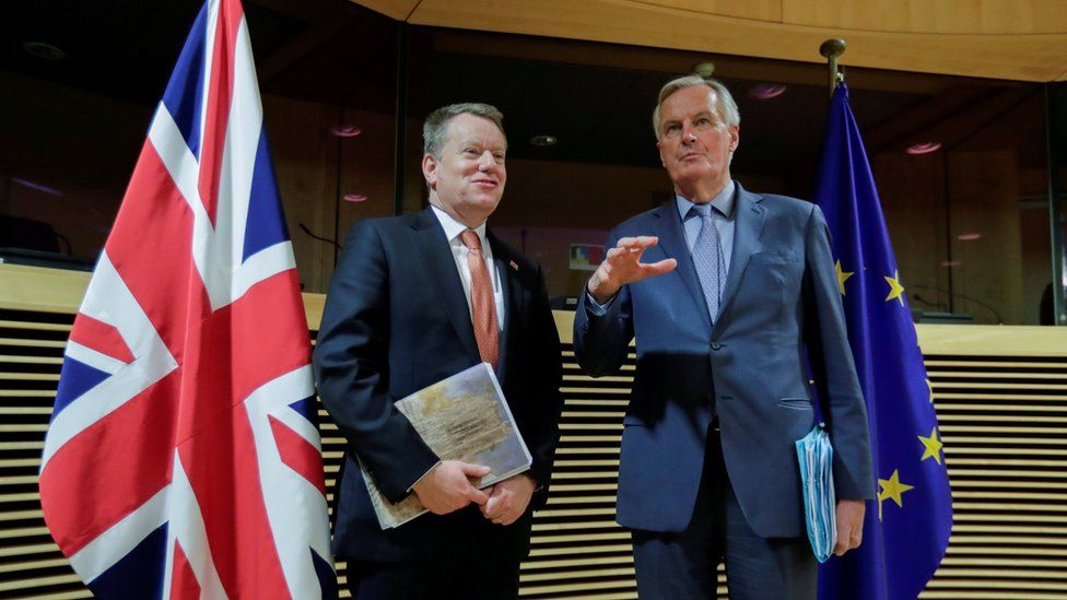 Lord David Frost (left) and Michel Barnier (right