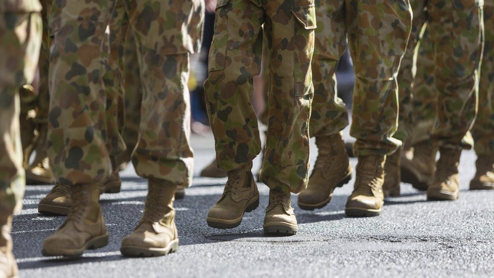 Unidentified Australian soldiers take part in an Anzac Day march