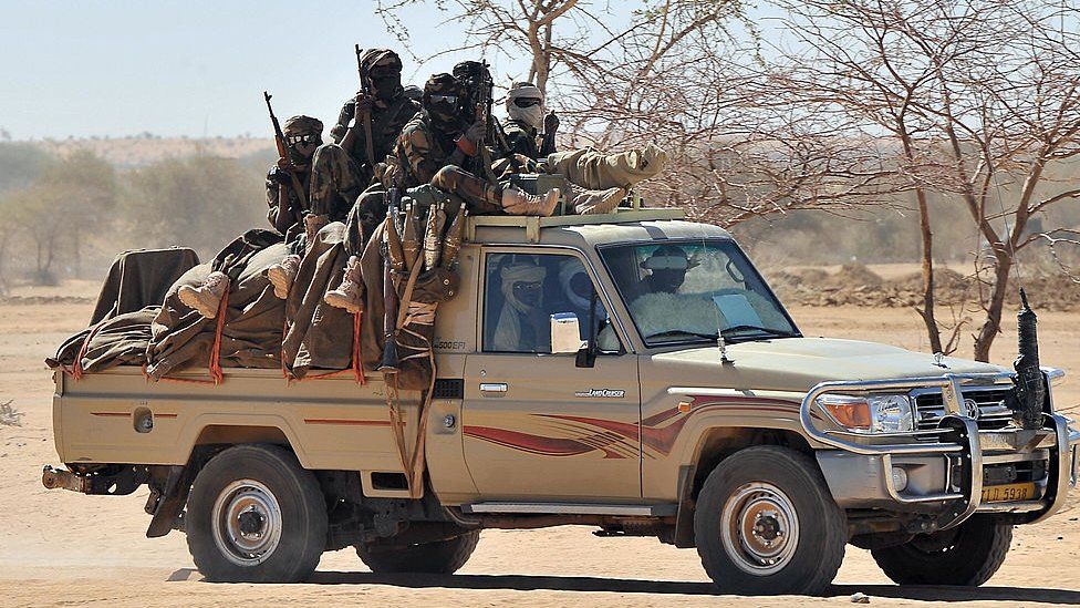 Soldiers from the Chadian army are driven in a pick-up near Iriba northern Chad -March 2009
