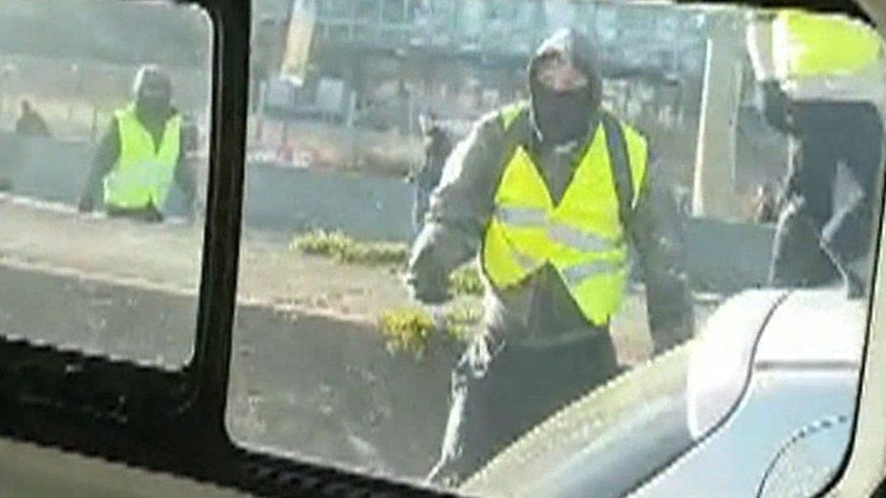 Yellow-vest protester filmed from a police van