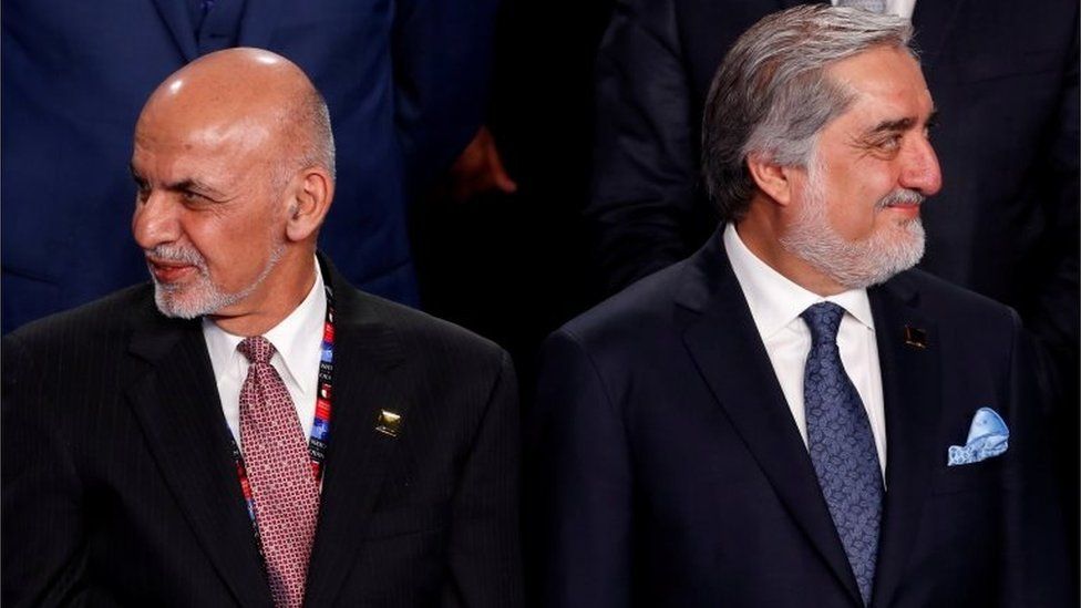 Ghani and Abdullah participate in a family photo with Ghani and Abdullah at the NATO Summit in Warsaw, Poland