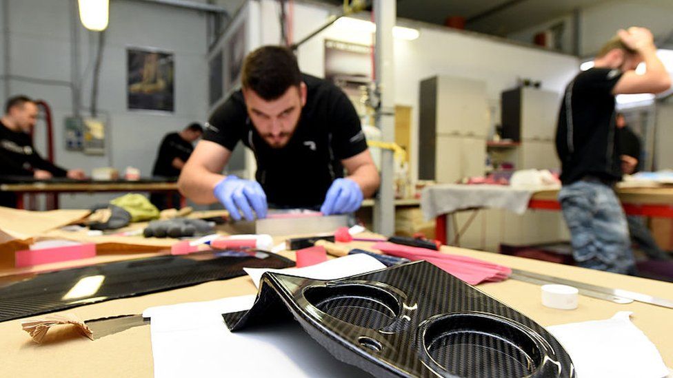 An engineer works on car parts at Mate Rimac's factory on the outskirts of Zagreb