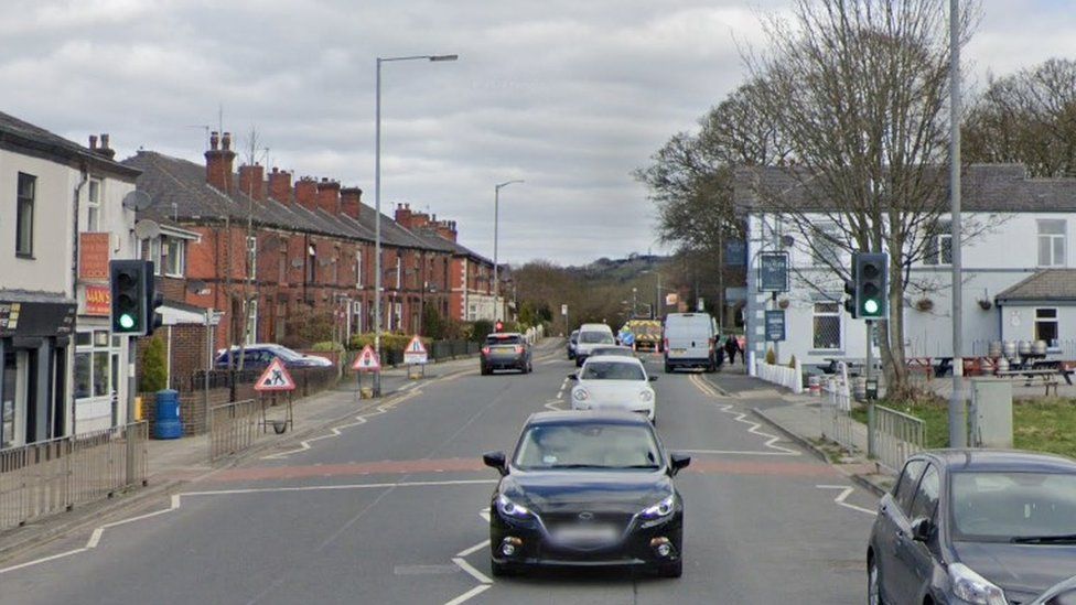 Pedestrian hit by car while crossing road in Bury dies - BBC News