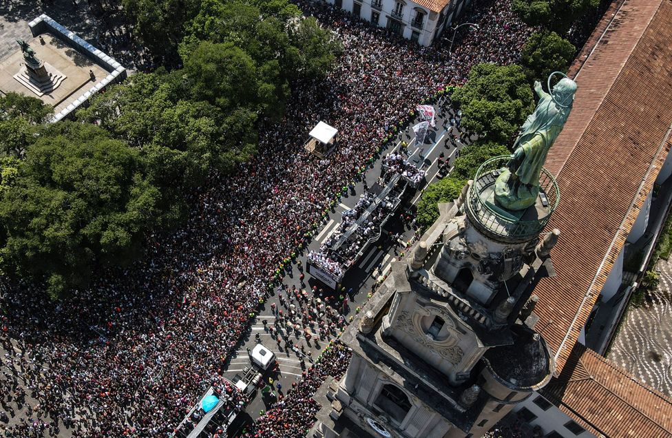 An aerial view shows Fluminense fans celebrating the team in a bus during the victory parade for winning the CONMEBOL Libertadores cup in Rio de Janeiro, Brazil, 12 November 2023.