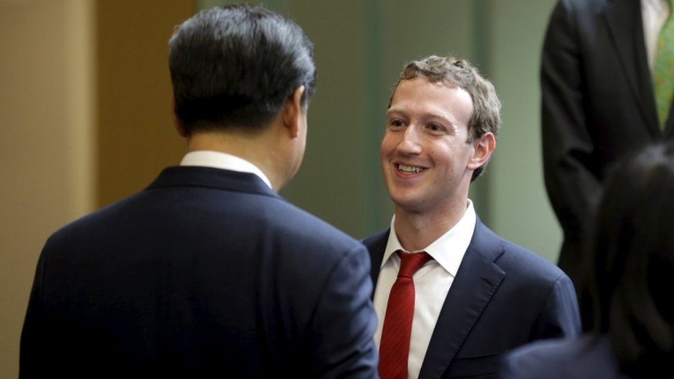 Chinese President Xi Jinping talks with Facebook chief executive Mark Zuckerberg