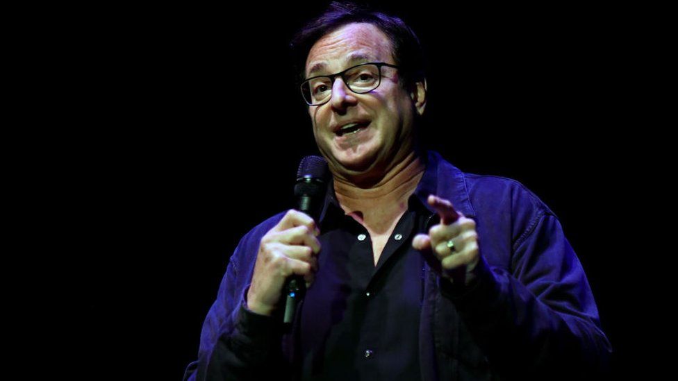 Bob Saget performing last year