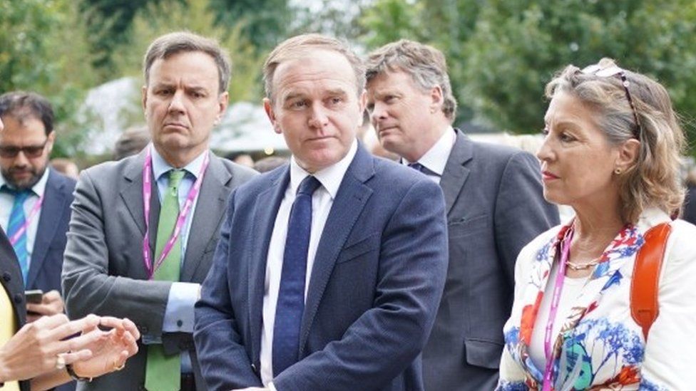 Environment Secretary George Eustice (centre) at the RHS Chelsea Flower Show