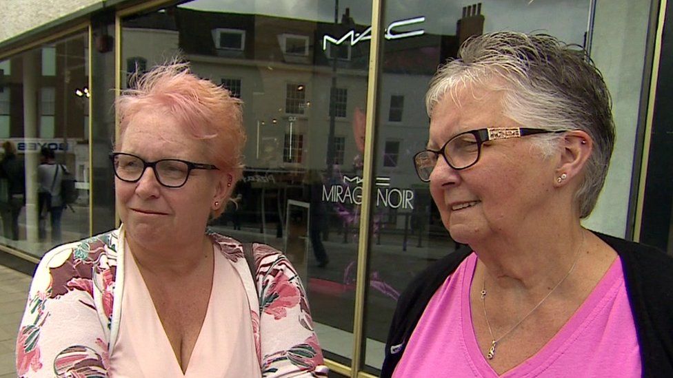 Two shoppers outside Binns / House of Fraser in Darlington