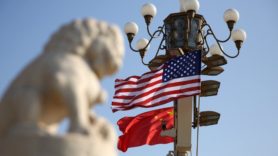Chinese and American national flags fly on Tian'anmen Square to welcome U.S. President Donald Trump on November 8, 2017 in Beijing, China.