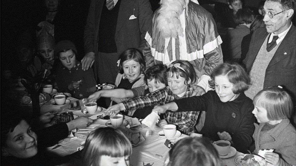 1939 photo of Llanidloes evacuees Christmas party at the Boys' Club; Henri Guerra far right