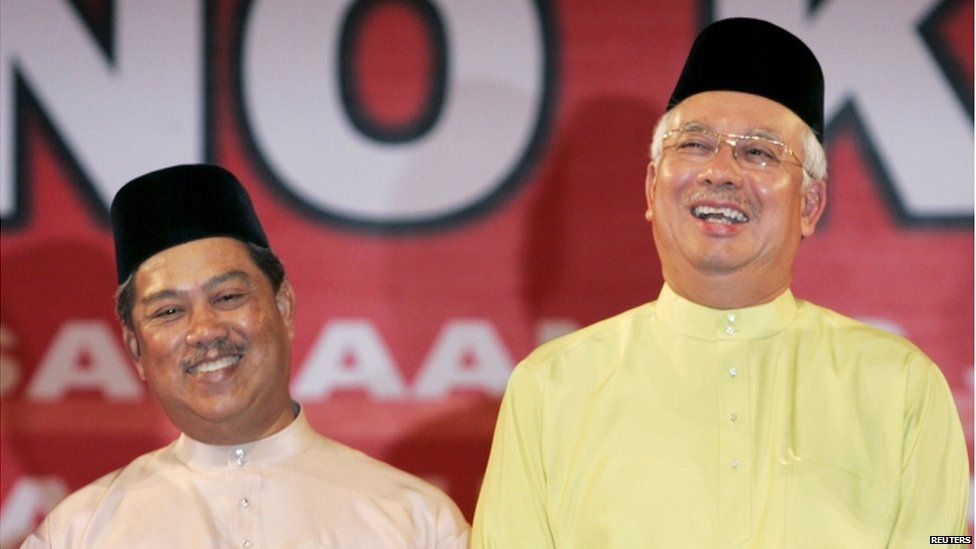 Malaysia' Prime Minister Najib Razak (R) and his deputy Muhyiddin Yassin share a light moment during the 63rd anniversary of the United Malays National Organization (UMNO) in Kuala Lumpur in this 11 May 2009 file photo