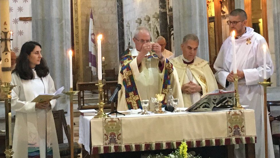 Justin Welby presides over holy communion at St George's Cathedral in Jerusalem