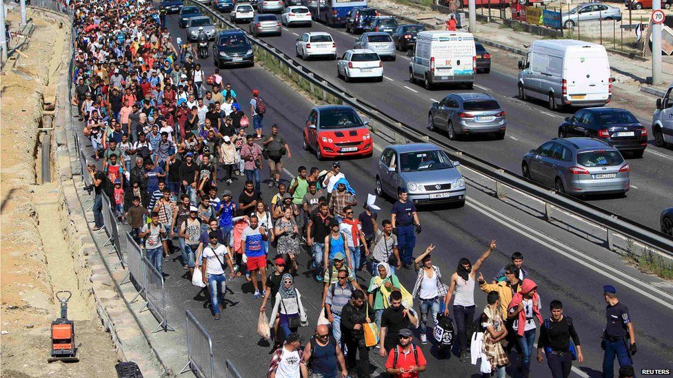 Migrants set off on foot for the border with Austria from Budapest, Hungary, September 4, 2015