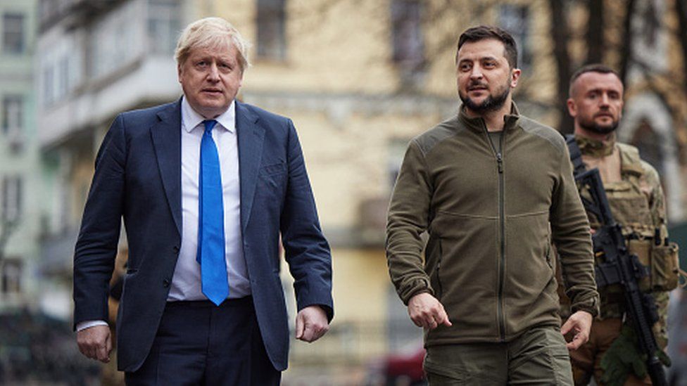 British Prime Minister Boris Johnson and Ukrainian President Volodymyr Zelenskyy walk in Kyiv