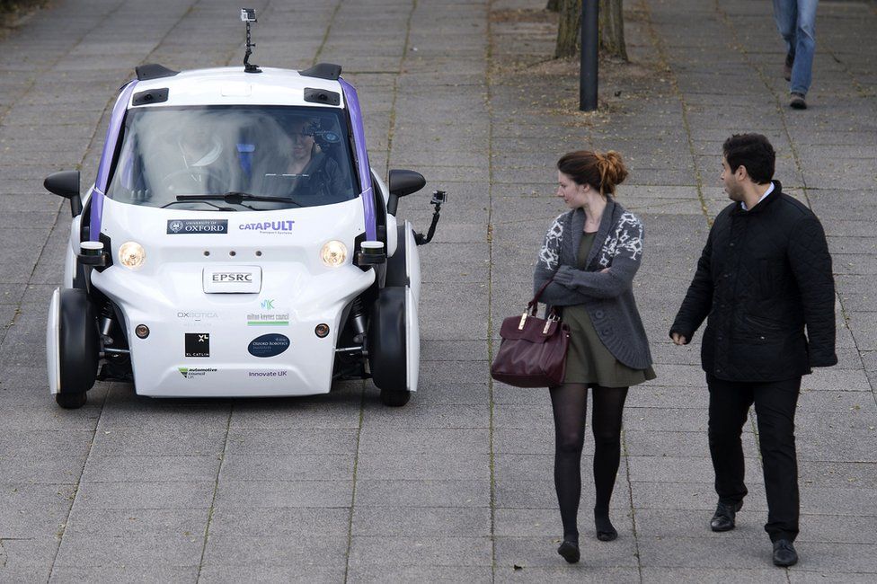 Autonomous car approaching two pedestrians