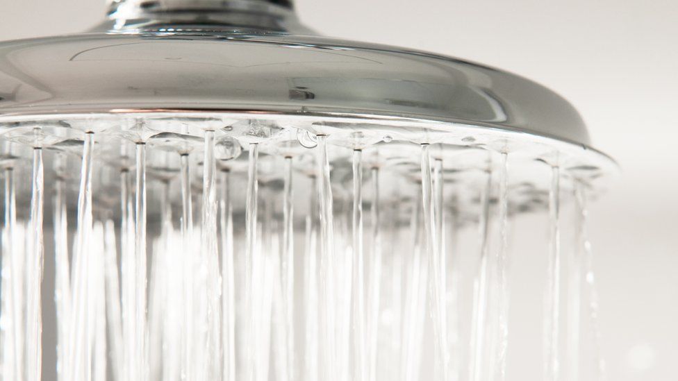 Water flowing from a shower head