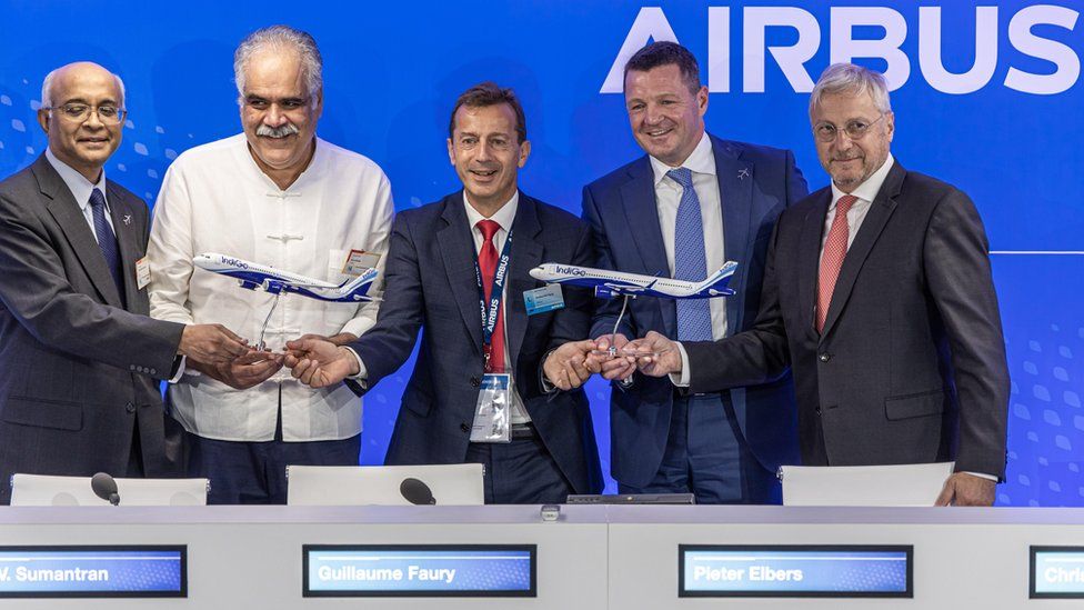 The co-founder of InterGlobe Aviation and the bosses of Airbus and IndiGo after signing the record order at the Paris Airshow