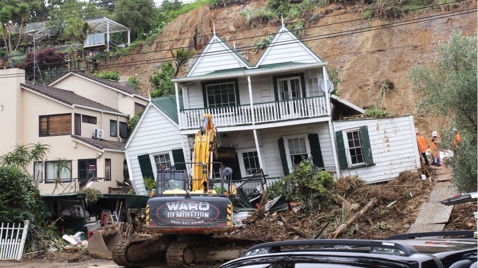 Clean up begins at a historic home that was knocked off its foundations in a large slip on January 29, 2023 in Remuera, Auckland, New Zealand.