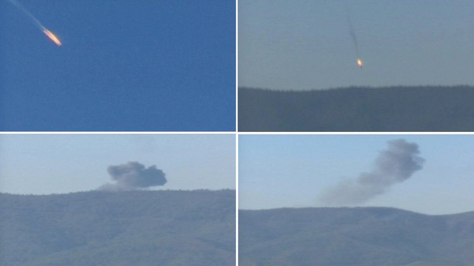 A combination picture taken from video shows a war plane crashing in flames in a mountainous area in northern Syria after it was shot down by Turkish fighter jets near the Turkish-Syrian border