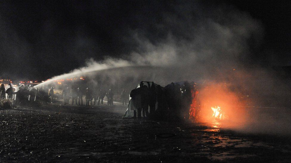 Police firing water cannons during the pipeline protests near Standing Rock Native American Reservation.