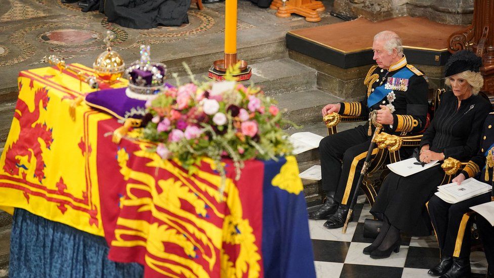 Queen's coffin and King Charles III and Queen Consort