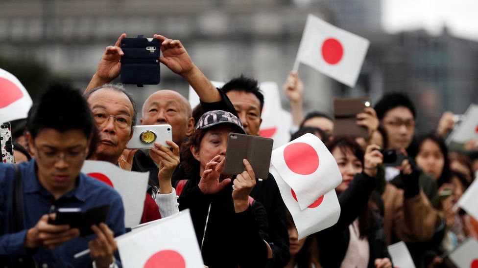 People wait outside the Imperial Palace after the enthronement ceremony of Japan"s Emperor Naruhito in Tokyo