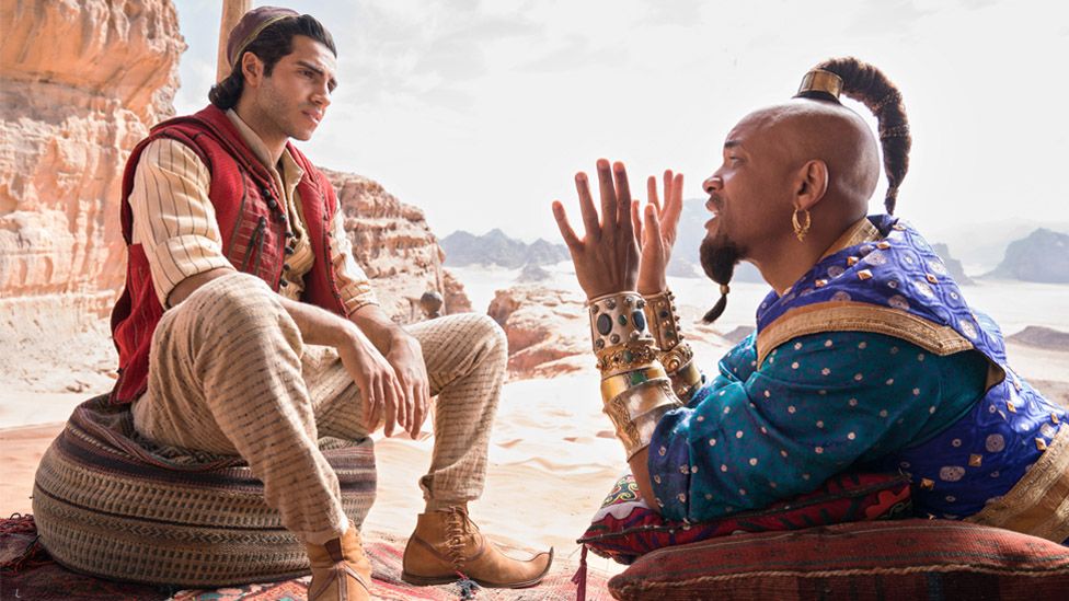 Mena Massoud as Aladdin and Will Smith as the Genie