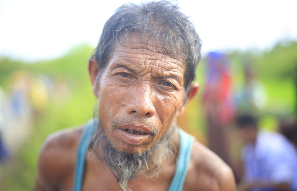 An exhausted Rohingya man whose eyes have witnessed deadly atrocities