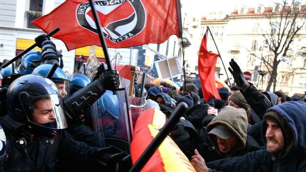 Police clash with demonstrators during an anti-fascist and anti-racist march against far-right party The League on Piazza Duomo in Milan, 24 February 2018