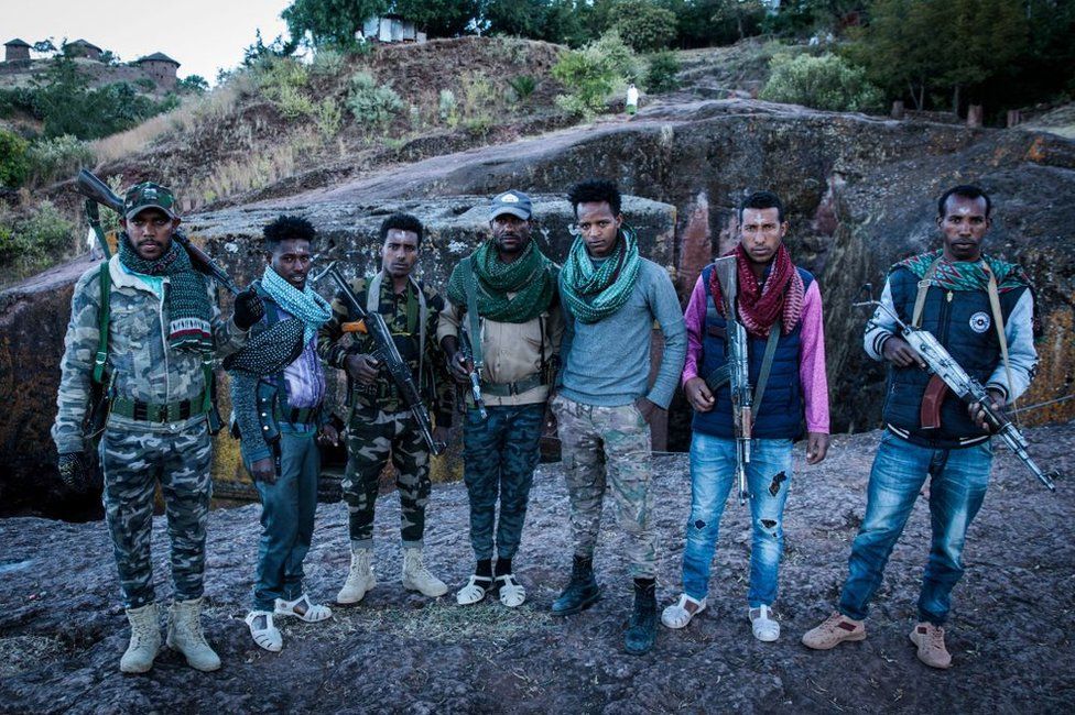 Amhara Fano militia fighters pose at Saint George Church in Lalibela, on 7 December 2021.