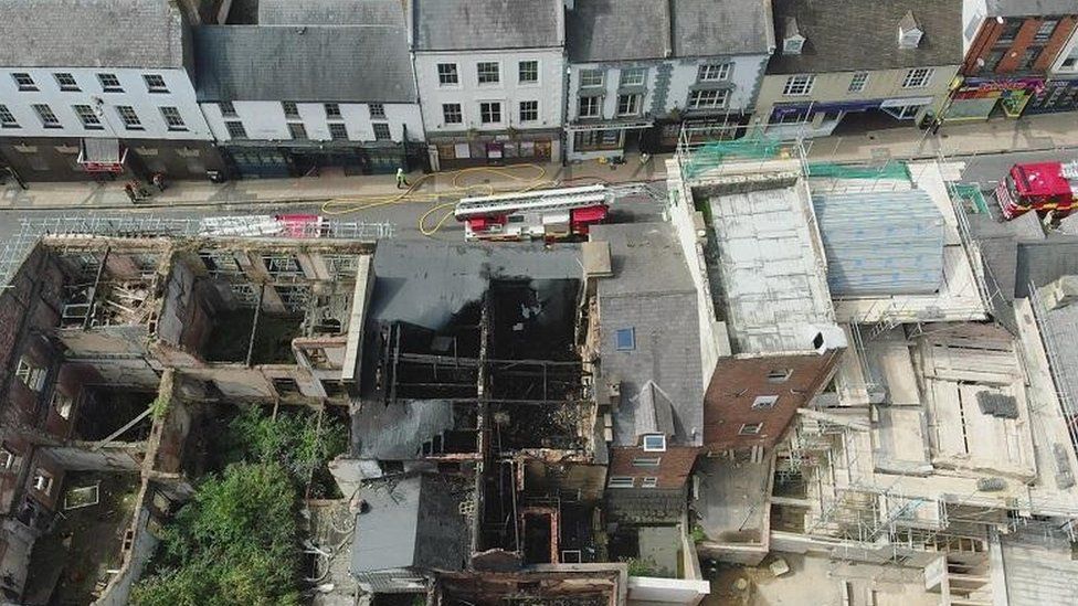 Aerial view of Bridge Street showing roofless fire-damaged building