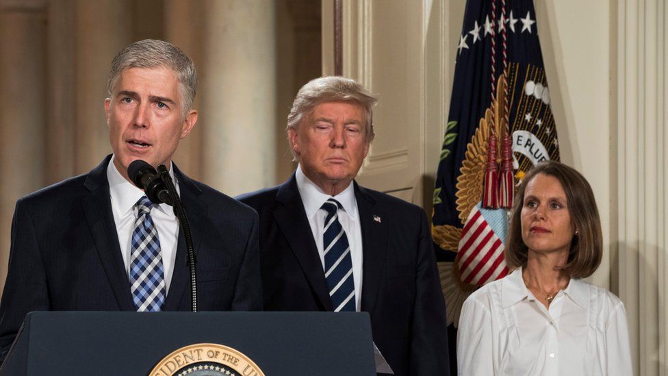 eil Gorsuch (L), federal judge serving on the 10th US Circuit Court of Appeals, delivers remarks after US President Donald J. Trump
