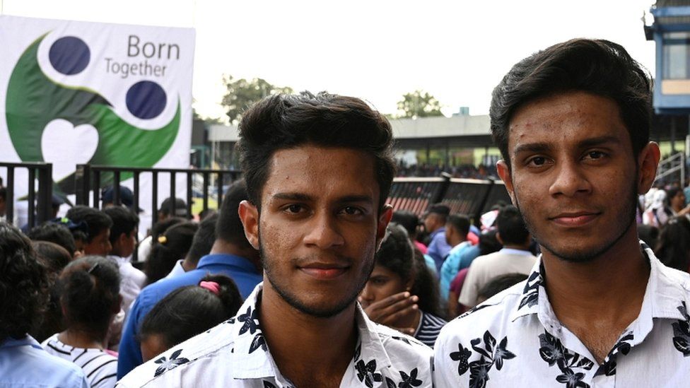 Sri Lankan twins pose for a picture during the Sri Lanka Twins event in Colombo on 20 January 2020