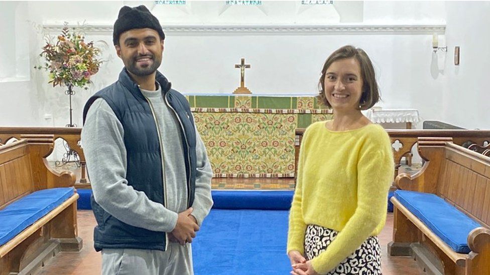 Sabah Ahmedi, 28, (left) who is one of Britain's youngest Imams, with Charlotte Mathias, treasurer at All Saints Church in Tilford, Surrey
