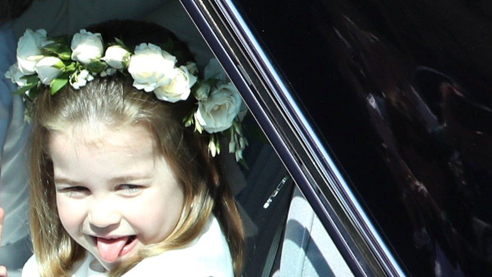Princess Charlotte sticks out her tongue on her way to the wedding of Prince Harry and Meghan Markle