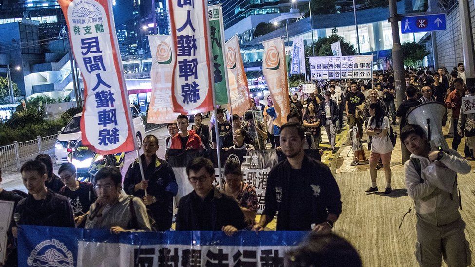 Protesters march in Hong Kong against a rumoured interpretation of the law by Beijing