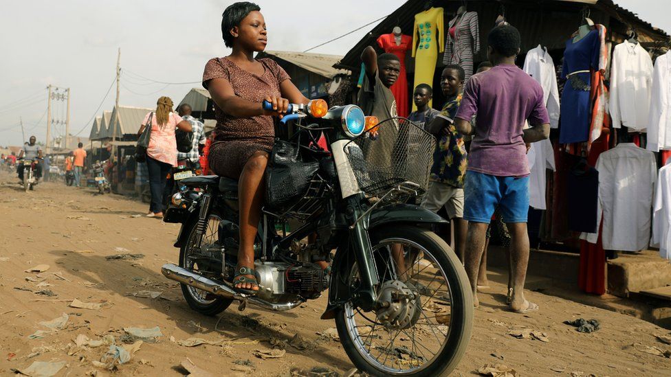 A woman rides a motorbike at Wurukum Market in Benue, Nigeria -Wednesday 11 April 2018
